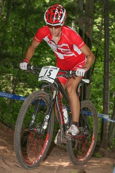 Lea Davison (USA) is going to London for the Games, and slots in second on lap three.