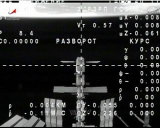 The International Space Station is seen in this view from a Russian Soyuz spacecraft camera after the two spacecraft undocked on Sept. 10, 2013 to return the Expedition 36 crew to Earth