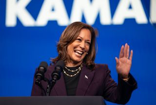 kamala harris in a dark purple suit