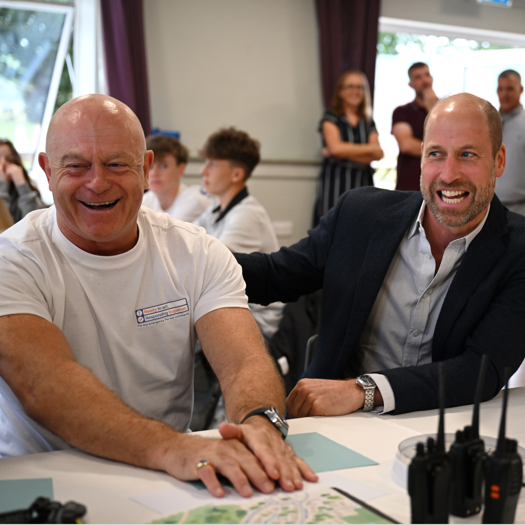 Prince William sitting at a table with Ross Kemp