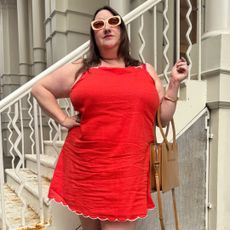 Sarah chiwaya wearing red mini linen dress from old navy 