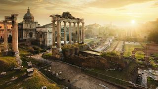 Roman Forum at sunrise, from left to right: Temple of Vespasian and Titus, church of Santi Luca e Martina, Septimius Severus Arch, ruins of Temple of Saturn.