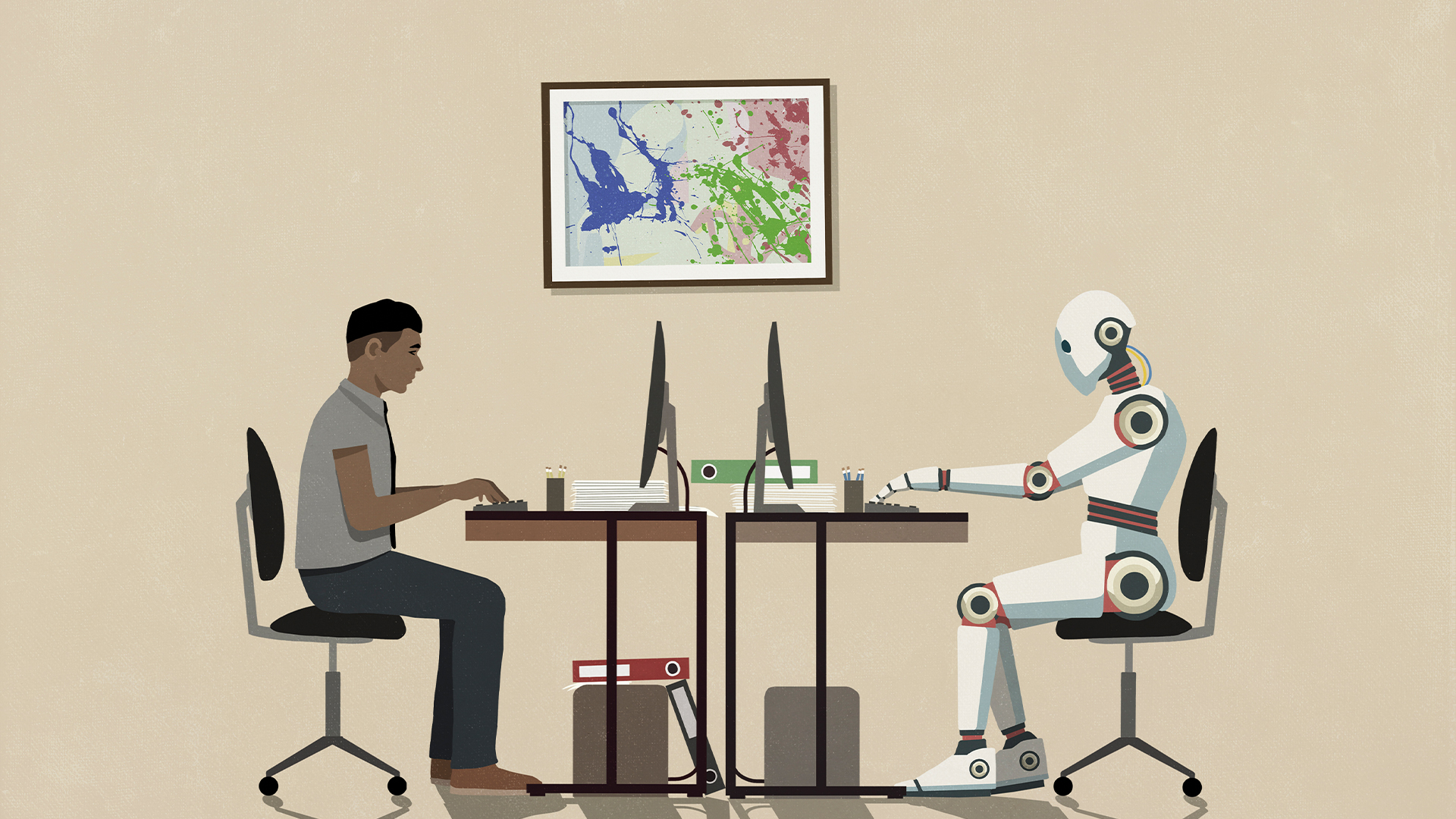 Male knowledge worker working on a desktop computer in a home office environment, with robotic humanoid worker on other side of desk working on computer.