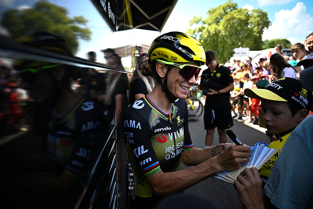 Team Visma | Lease a Bike's French rider Pauline Ferrand-Prevot signs an autograph prior to the 7th stage (out of 9) of the fourth edition of the Women's Tour de France cycling race, 159.7 km from Bourg-en-Bresse to ChambÃ©ry, in Bourg-en-Bresse, south-eastern France on August 1, 2025. (Photo by JULIEN DE ROSA / AFP)