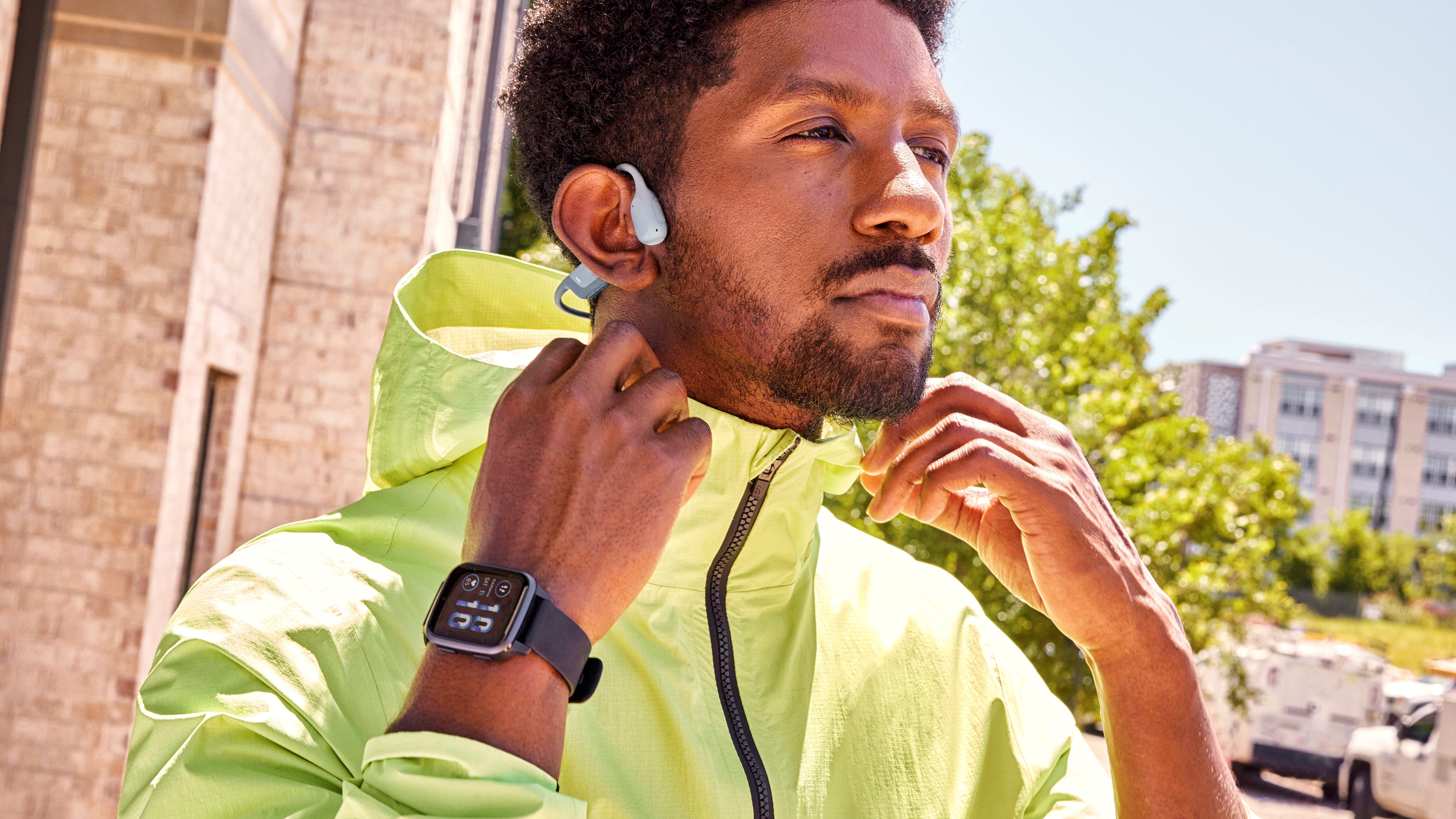 a photo of a man wearing the Garmin Venu Sq 2