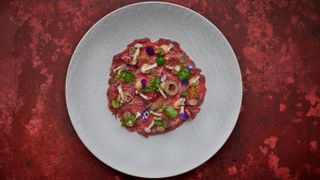 Beef carpaccio with pickled shimeji, pine nut purée, truffle and sourdough croutons