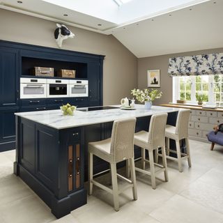 Navy and white kitchen with large island unit