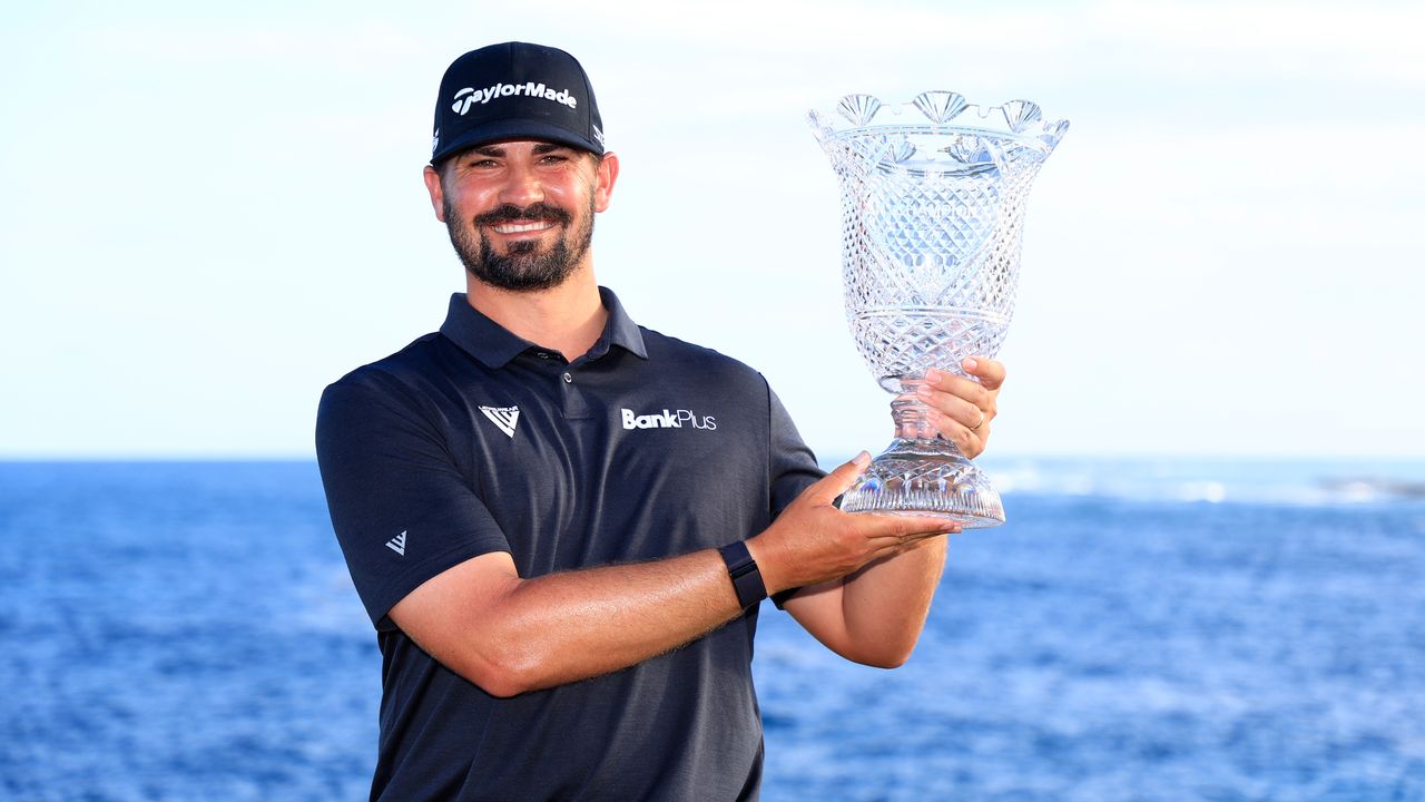 Chad Ramey poses with the trophy after winning the 2022 Corales Puntacana Championship in the Dominican Republic