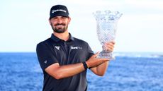 Chad Ramey poses with the trophy after winning the 2022 Corales Puntacana Championship in the Dominican Republic