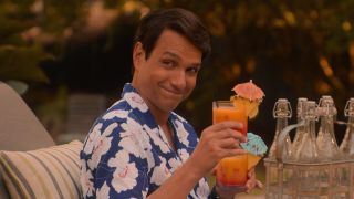 Ralph Macchio in Cobr Kai holding some tropical drinks