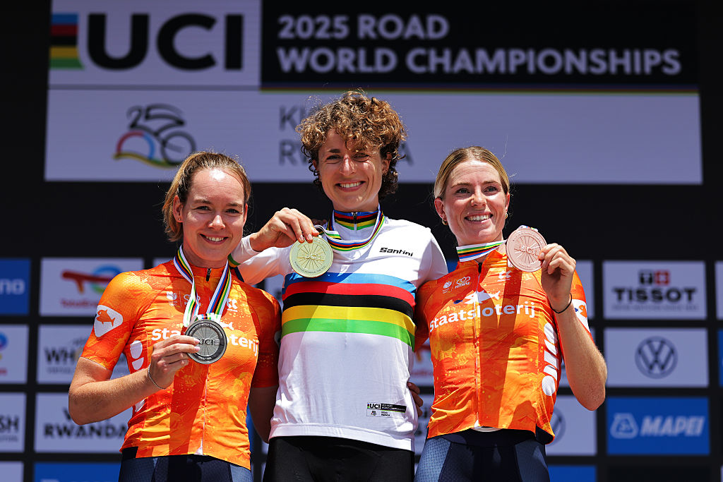 Picture by Alex Whitehead/SWpix.com - 21/09/2025 - Cycling - 2025 UCI Road World Championships - BK Arena to Kigali Convention Centre, Kigali, Rwanda - Women Elite Individual Time Trial (ITT) Podium - Marlen Reusser (Switzerland) receiving the Gold Medal to become World Champion with Anna van der Breggen (Netherlands) receiving the Silver Medal and Demi Vollering (Netherlands) receiving the Bronze Medal