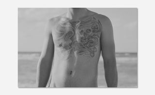 man has a tattoo in his chest