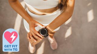 a photo of a woman pausing sports watch
