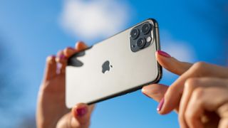 An iPhone being held up to take a photo