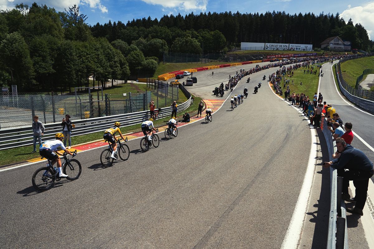 The peloton hitting high speeds on the Circuit de Spa-Francorchamps in Belgium