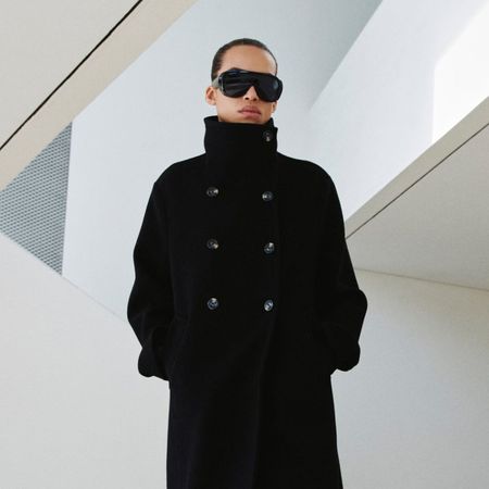 Model wears Mango cardigan with cream gloves