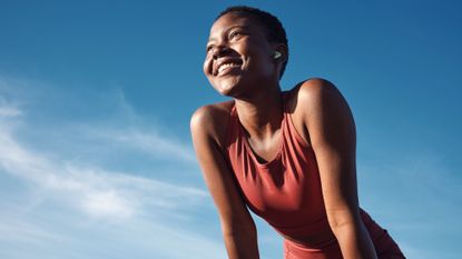 Running deals: A woman catching her breath post run