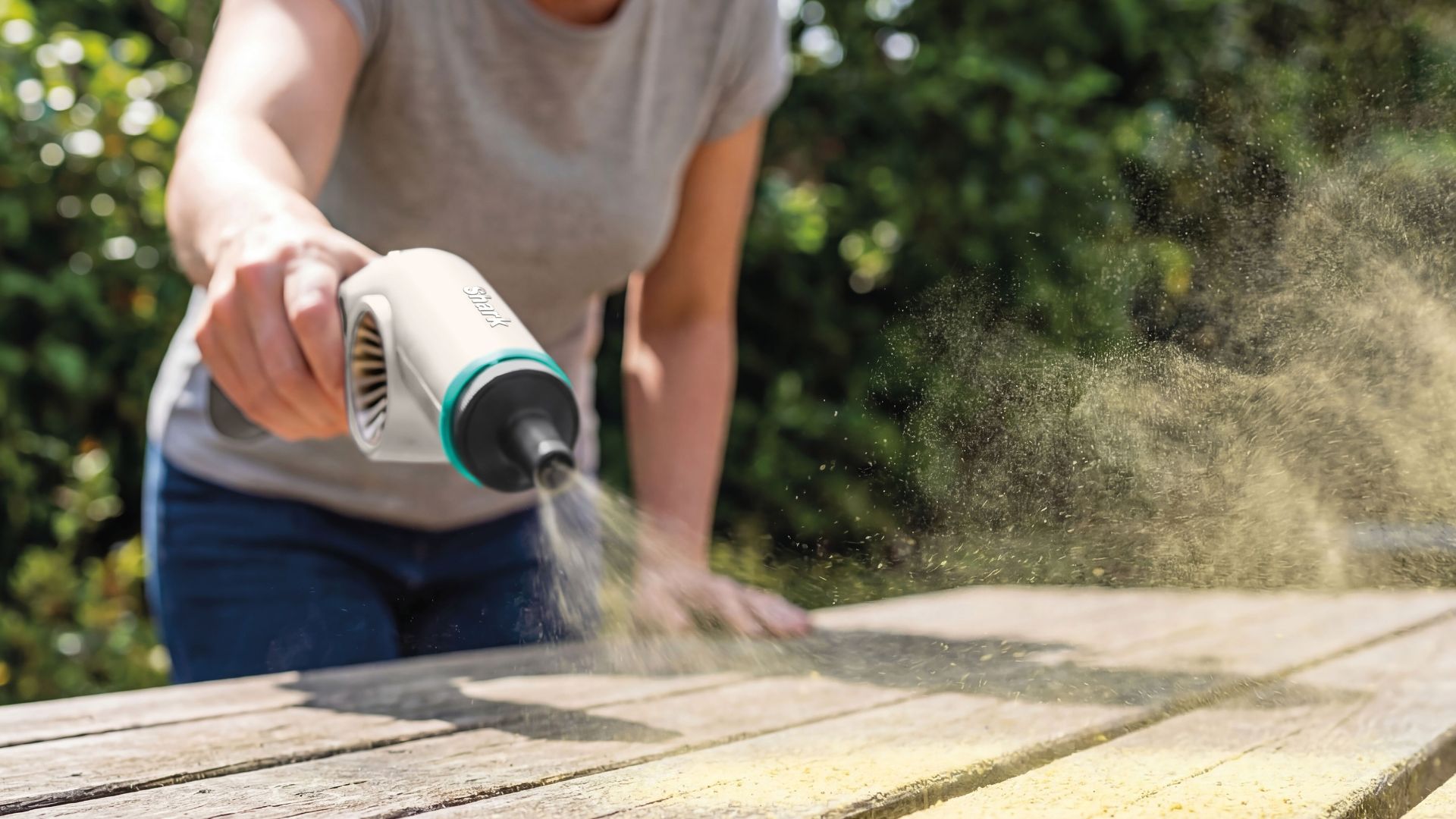 The Shark BlastBoss All In One Cleaner being used to clean a table