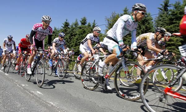 The peloton crests one of stage one's climbs.