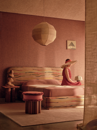 photoshoot of a desert-inspired color scheme with modern furniture and a model wearing fashionable clothes