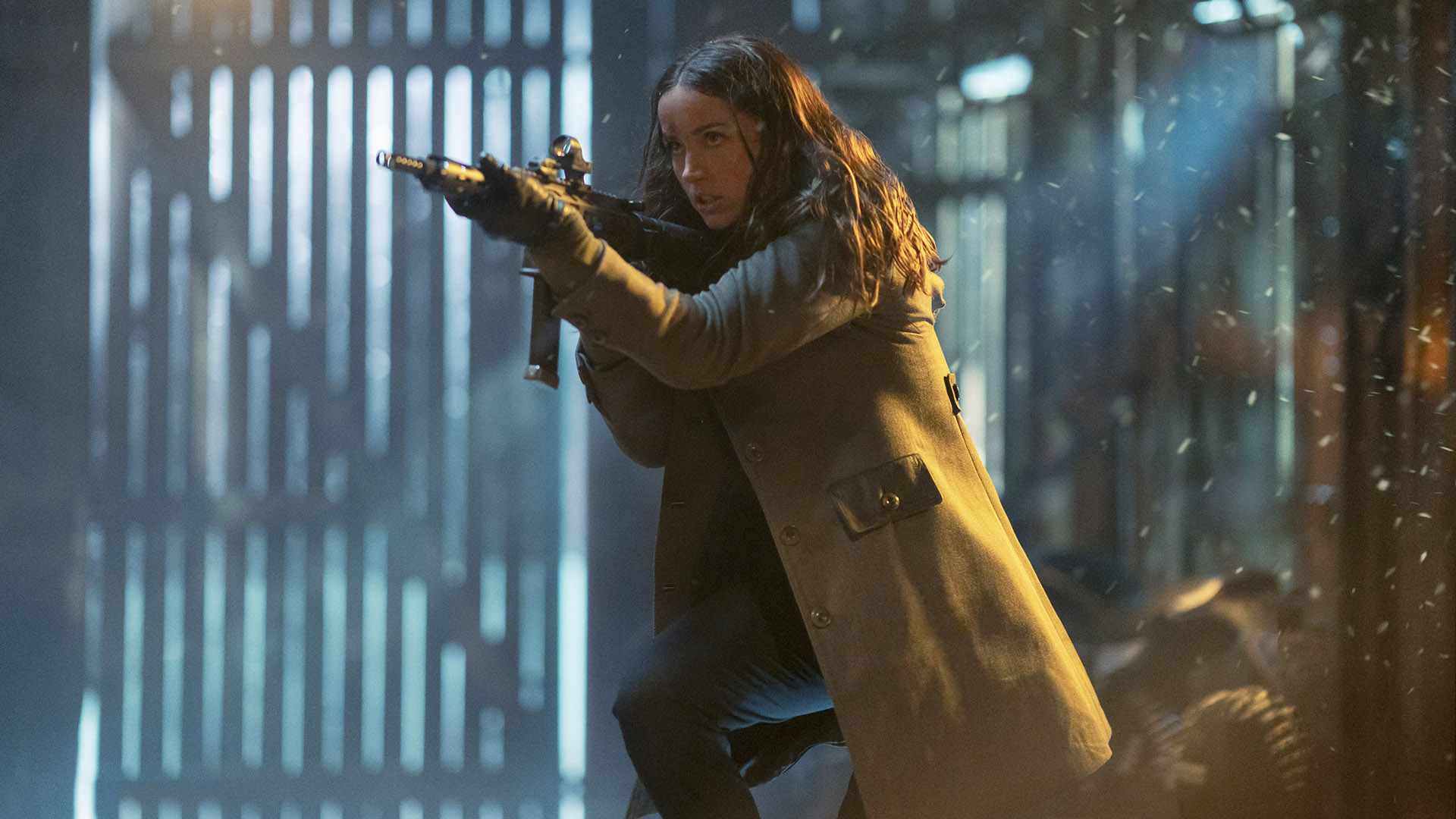 Eva Macarro holding a rifle in a barn in Ballerina: From the World of John Wick