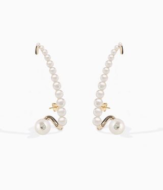 Pearl-lined earrings designed to curve around the ear