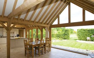 Dining room and kitchen in timber-frame extension
