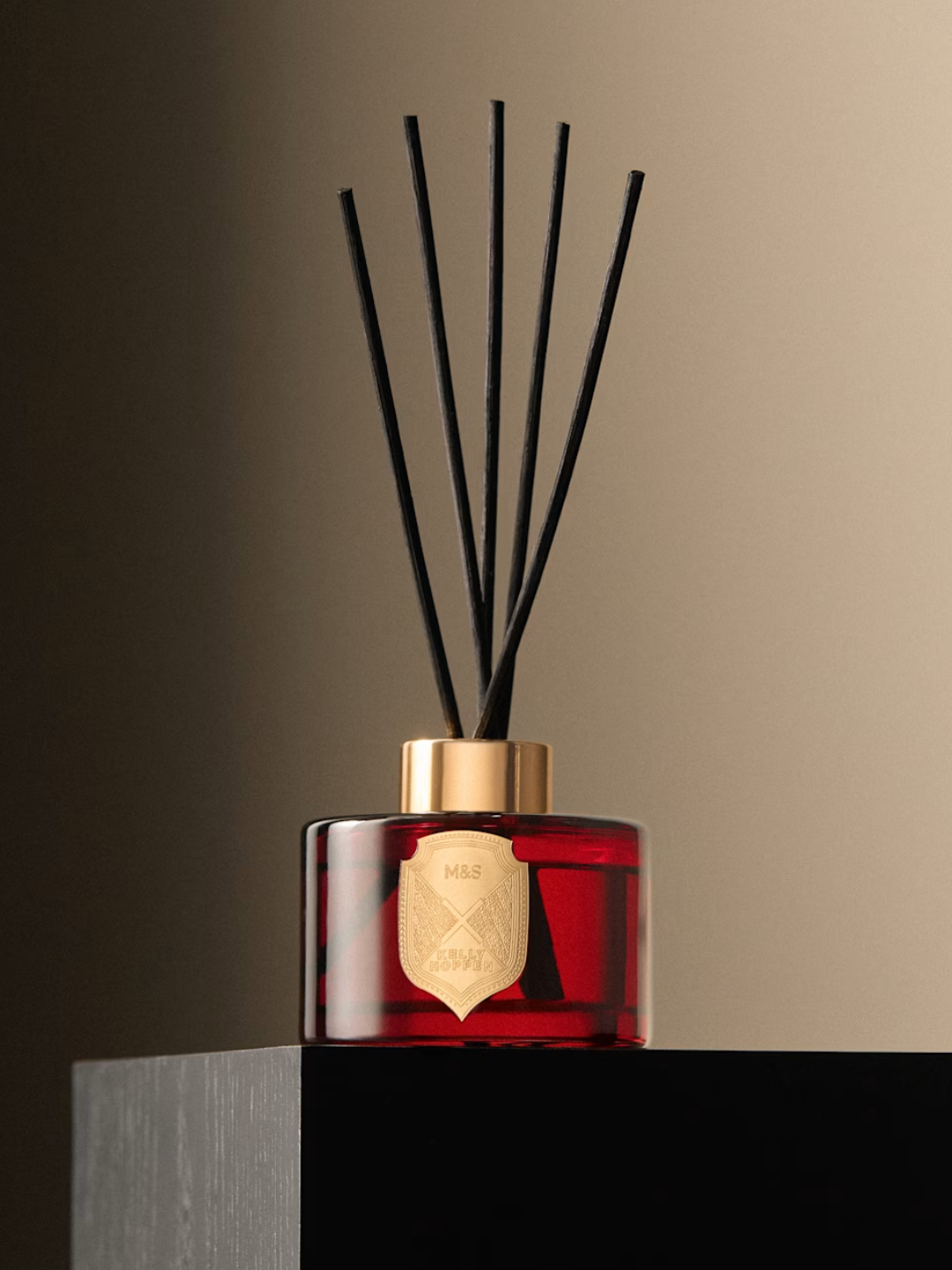A red glass reed diffuser from M&amp;amp;S x Kelly Hoppen
