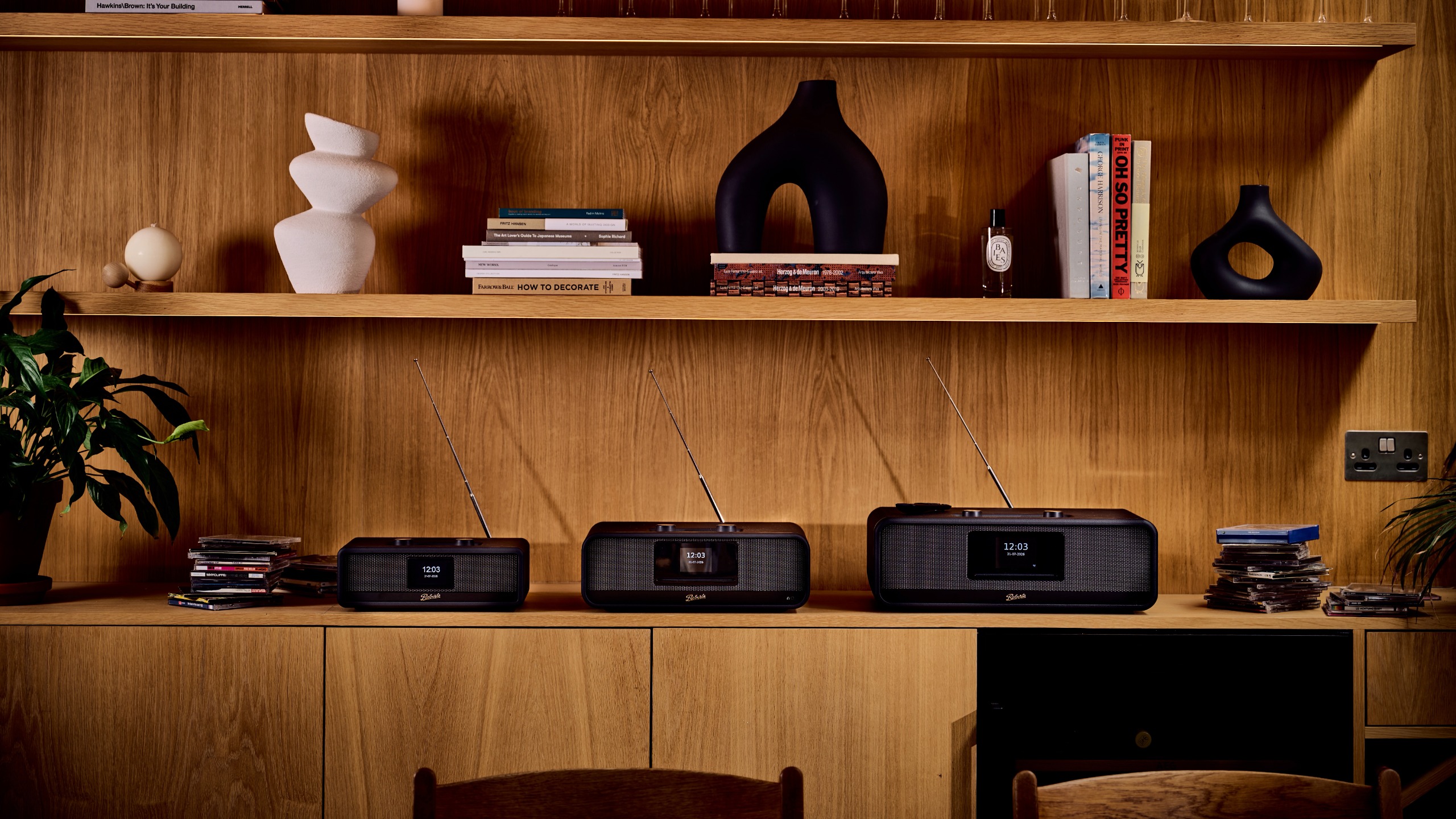Three Roberts Revere radios on a wooden shelf