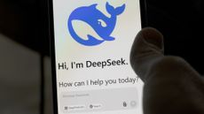 A person's hand using DeepSeek on their mobile phone