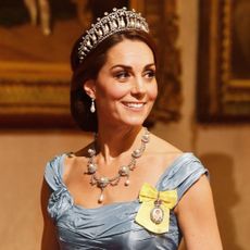 Princess Kate wearing a blue gown and the Lover's Knot Tiara