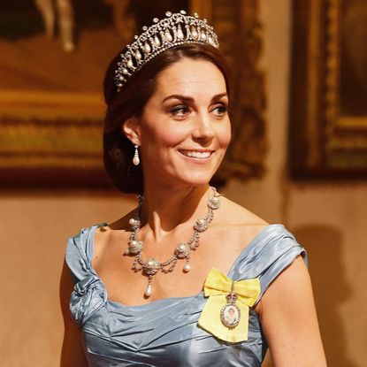 Princess Kate wearing a blue gown and the Lover's Knot Tiara