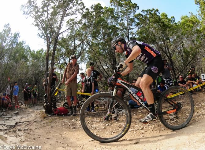 Spencer Paxson (Kona) riding to an 8th place finish