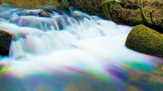 Harris shutter effect creates rainbow-colored water in a waterfall