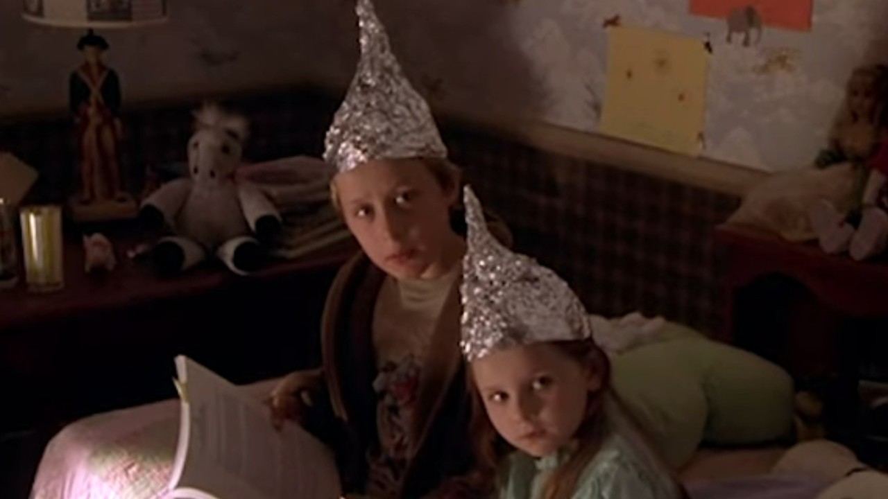tinfoil hat-wearing children in Signs