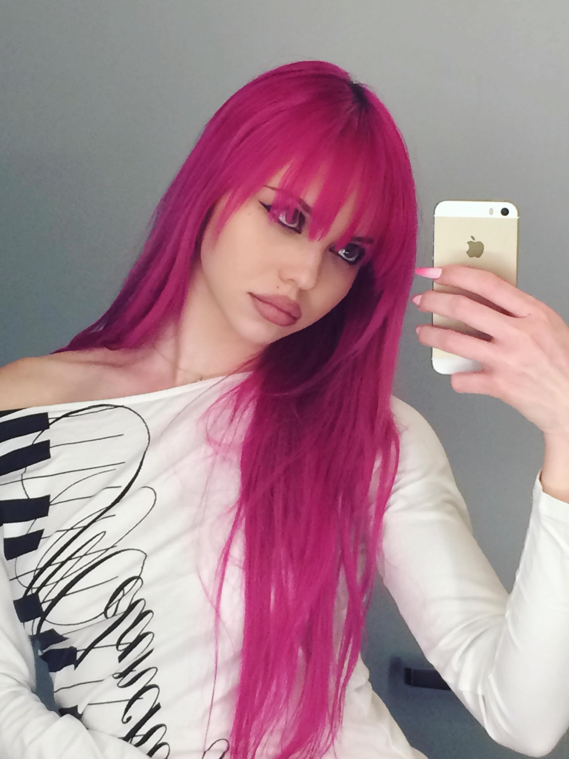 Adela with pink hair.