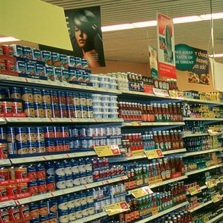 supermarket with product shelving and posters