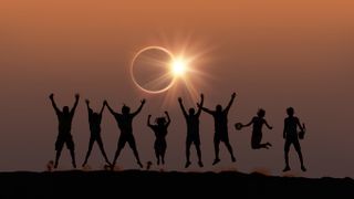 Total Solar Eclipse showing people wearing glasses and looking at the eclipse