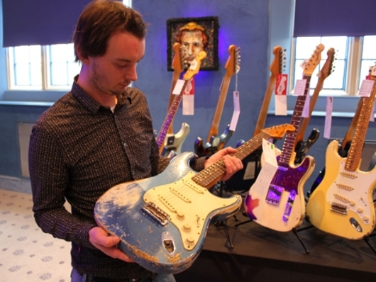 Stu examining a 1962 Heavy Relic Stratocaster