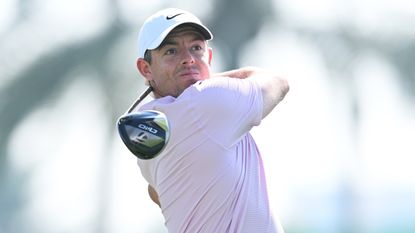 Rory McIlroy takes a shot in a practice round before the 2024 Dubai Invitational