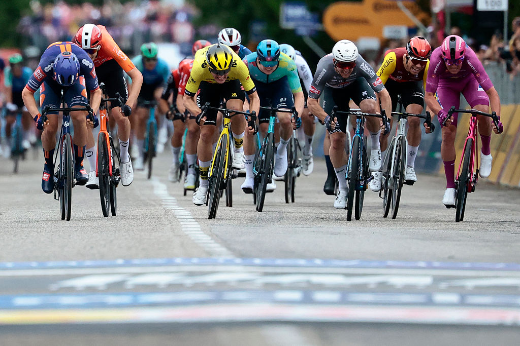 Team Visma-Lease a Bike's Dutch rider Olav Kooij, Team Picnic PostNL's Dutch rider Casper Van Uden and Lidl-Trek's Danish rider Mads Pedersen sprint to the finish of the 12th stage of the 108th Giro d'Italia cycling race 172kms from Modena to Viadana on May 22, 2025. (Photo by Luca Bettini / AFP)