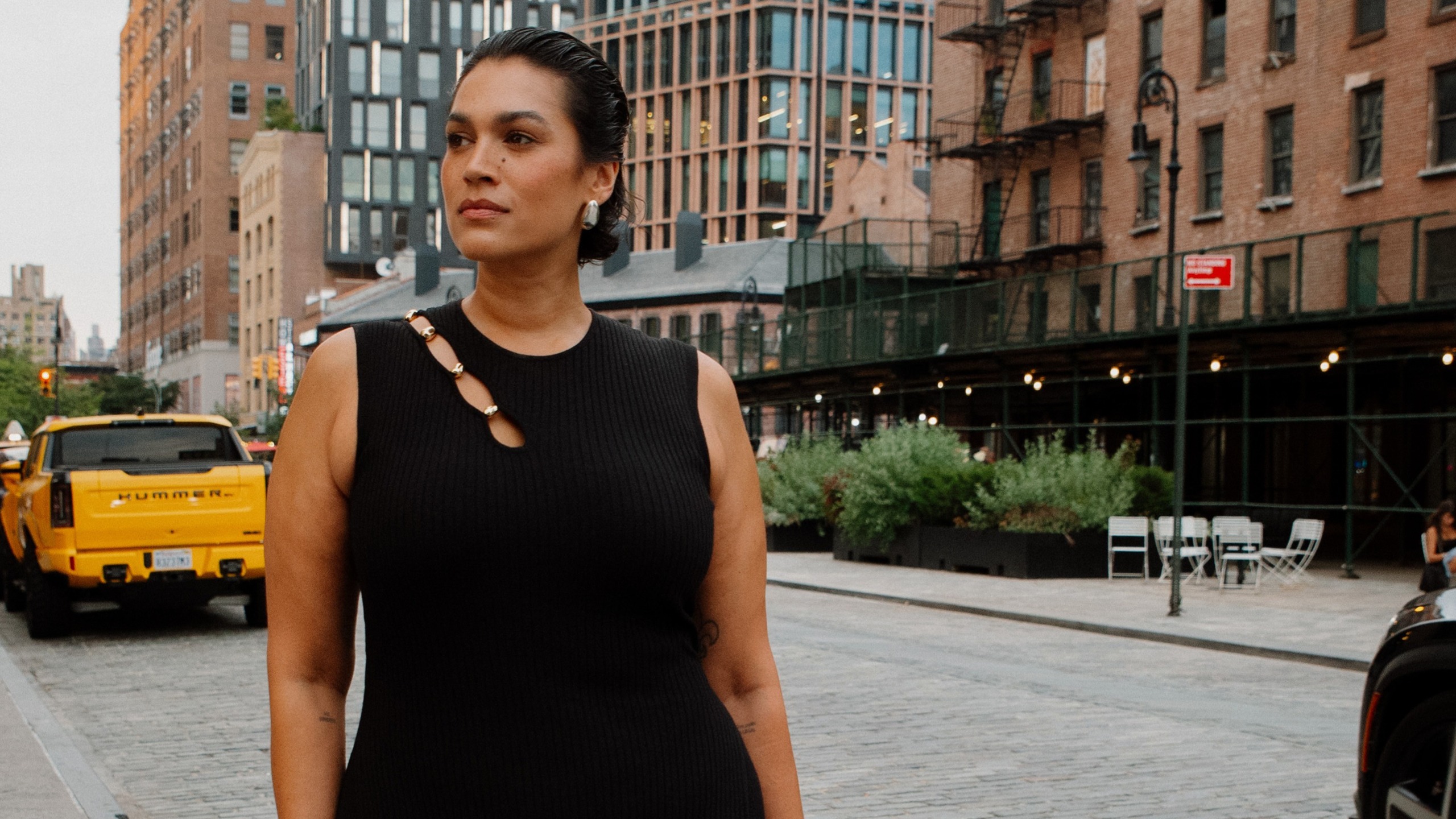 jennifer atilemile wearing a knit maxi dress