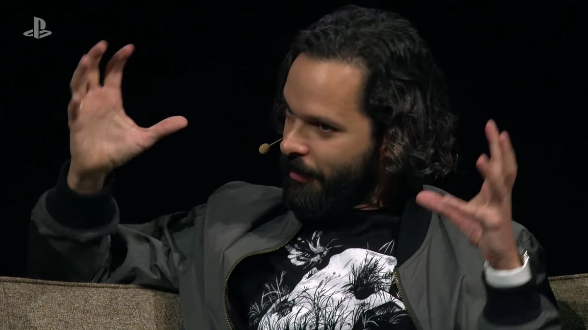 Naughty Dog creative director Neil Druckmann gestures on stage.