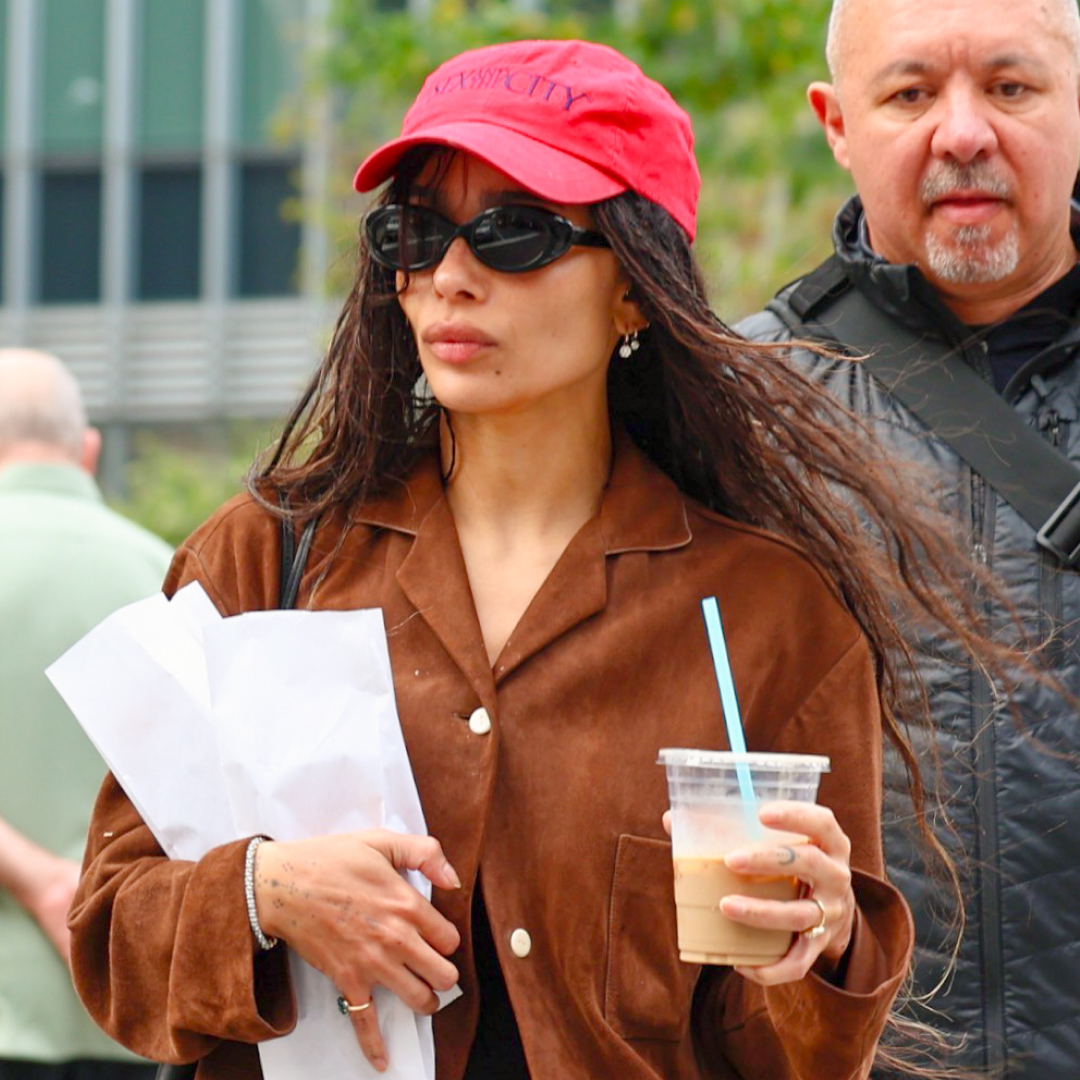 Zoe Kravitz wears a suede jacket with hot pants and ballet flats