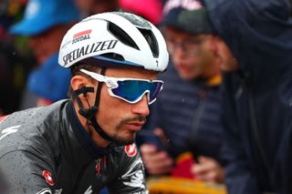 Team Soudal-Quick Step's French rider Julian Alaphilippe goes to attend the signature ceremony before the start of the 20th stage of the 107th Giro d'Italia cycling race, 184km between Alpago and Bassano del Grappa on May 25, 2024. (Photo by Luca Bettini / AFP)