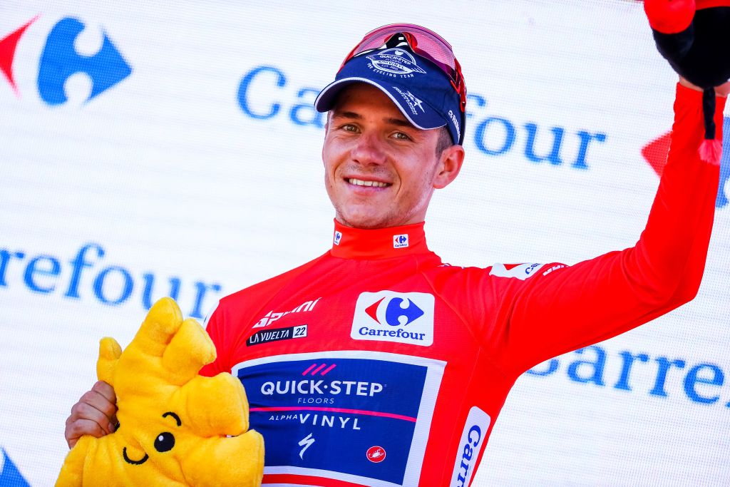 Belgian Remco Evenepoel of QuickStep Alpha Viny celebrates on the podium in the red jersey for leader in the overall ranking after stage 16 of the 2022 edition of the Vuelta a Espana Tour of Spain cycling race from Sanlucar de Barrameda to Tomares 1894 km Spain Tuesday 06 September 2022 BELGA PHOTO DAVID PINTENS Photo by DAVID PINTENS BELGA MAG Belga via AFP Photo by DAVID PINTENSBELGA MAGAFP via Getty Images