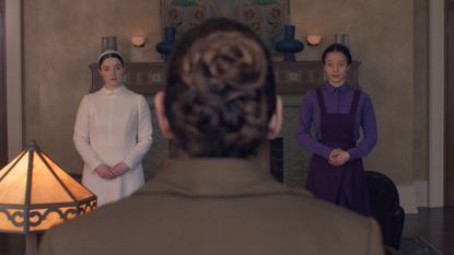 Daisy and Agnes appear on each side of the back of Aunt Lydia's head