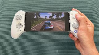 The GameSir G8+ MFi mobile controller on a green surface