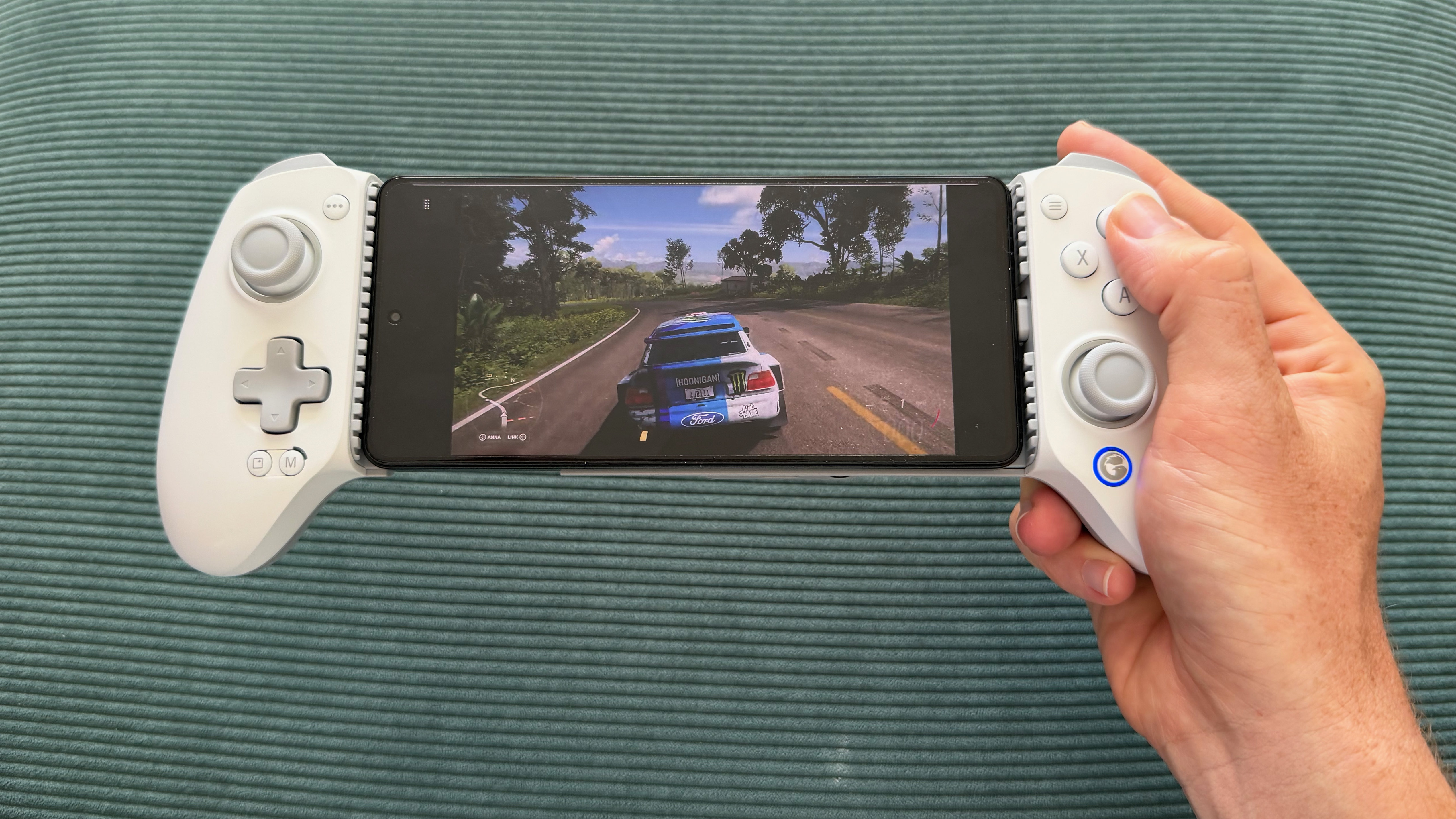 The GameSir G8+ MFi mobile controller on a green surface