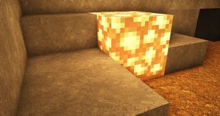 Minecraft texture packs - A glowstone illuminates HD stone and dirt textures around it.